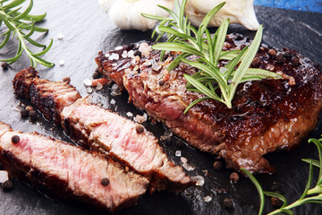Barbecue Rib Eye Steak on Slate Slab - Dry Aged Wagyu Entrecote Steak and rosemary