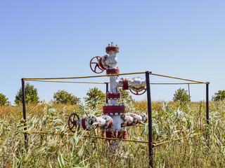 Well for oil and gas production. Oil well wellhead equipment. Oil production