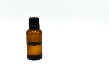 Glass bottle of tea tree oil isolated on white background