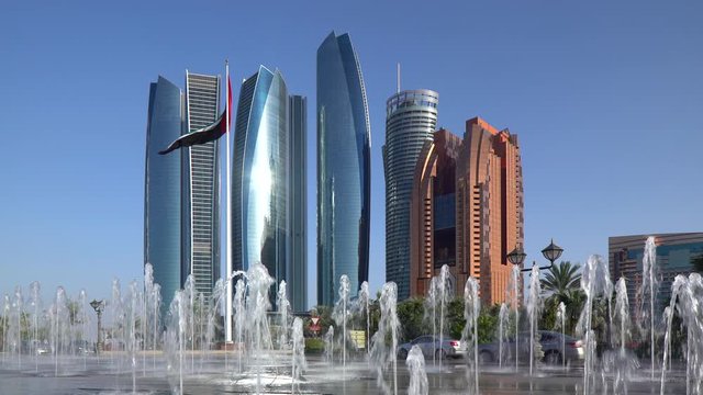 Etihad Towers viewed over the fountains of the Emirates Palace Hotel, Abu Dhabi, United Arab Emirates, Middle East