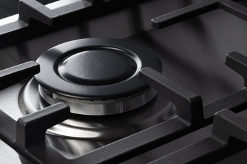 The hob burner on a stainless steel gas stove