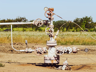 Well for oil and gas production. Oil well wellhead equipment. Oil production