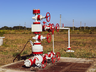Well for oil and gas production. Oil well wellhead equipment. Oil production