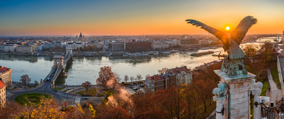 Budapest, Hungary - Aerial panoramic view of Budapest, taken from Buda Castle Royal Palace at autumn sunrise. Szechenyi Chain Bridge, River Danube and St. Stephen's Basilica at background