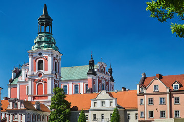 Fototapeta na wymiar buildings with belfry of baroque Catholic Church in Poznan.