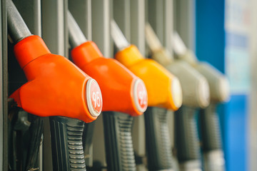 Gas station. Colorful Petrol pump filling nozzles.