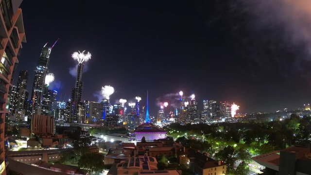 NYE Fireworks over the city of Melbourne Australia timelapse, new years eve, year  two thousand and twenty wide and colourful