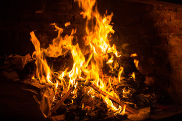 campfire burning wood and paper