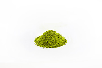 Heap of extract green Tea powder on white floor background.