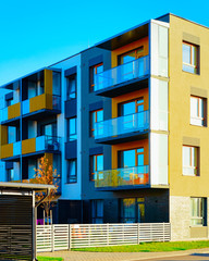 Obraz premium Apartment in residential building exterior. Housing structure at blue modern house of Europe. Rental home in city district on summer. Architecture for business property investment, Vilnius, Lithuania.