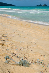 Rope and microplastic pollution littering Waimanalo Beach in Hawaii