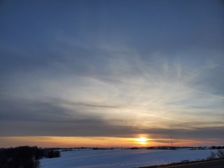 Sunset over farm field