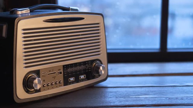 modern vintage music player on the table by the window