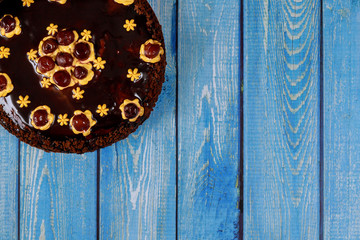 Obraz na płótnie Canvas Rum chocolate cake with caramel cream and cherry.