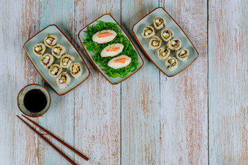 Set of sushi roll with soy sauce, ginger and chopstick. Japanese cuisine.