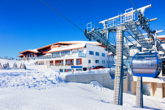 Cable cars at restaurant chalet in Hintertux Glacier ski resort in Tyrol in Mayrhofen, Zillertal valley, Austria in winter Alps. Chair lifts at cafe house in Hintertuxer Gletscher in Alpine mountains