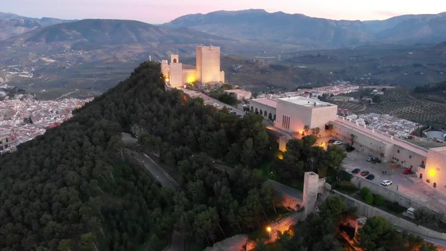 Jaen's Castle Saint Catalina Castle Spain shoot with a drone at 4k 24fps showing the exterior and the city from multiple points on a afternoon in December.