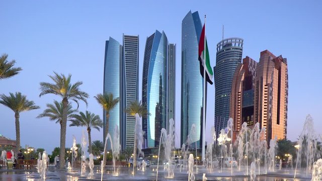 Etihad Towers viewed over the fountains of the Emirates Palace Hotel, Abu Dhabi, United Arab Emirates, Middle East
