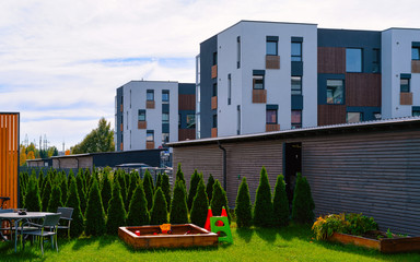 Fototapeta na wymiar Apartment in residential building exterior. Housing structure at blue modern house of Europe. Rental home in city district on summer. Architecture for business property investment, Vilnius, Lithuania.