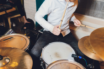 Modern drum set in studio prepared for playing.