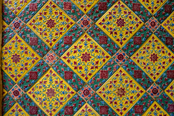 Ancient Thai pattern on wall in Thailand Buddha Temple , Asian Buddha style art