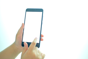 child's finger touches the screen of the smartphone On a white background.shallow focus effect.