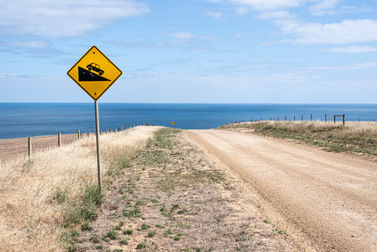 Steep Descent, warning sign on Australian rural road, down to the beach.