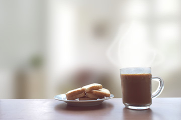 Coffee and bread on a wooden table