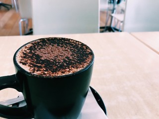 cup of coffee on table in cafe