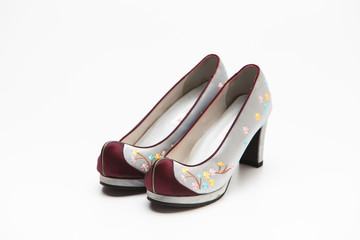Korean traditional flower shoes on a white 