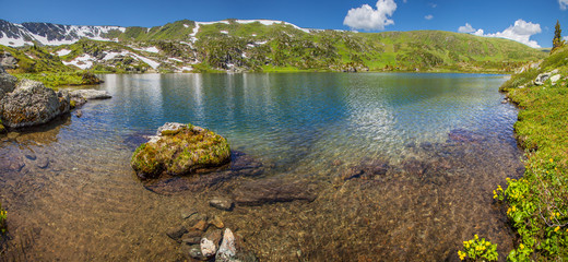 Panoramic view of a mountain lake, picturesque summer landscape