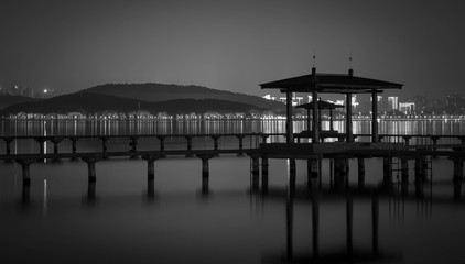 Night view of  Chinese Pavillion and Chinese bridge with light decoration at East Lake Wuhan, Hubei, China
