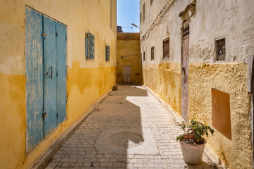 Fototapeta na wymiar Beautiful yellow alley in Fez el-Jdid Medina, Morocco