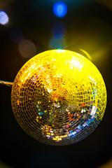 Disco ball. The light hits the Disco ball. On the night of the party.