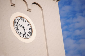 clock on blue sky