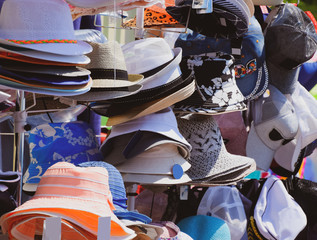 Hats from the sun. Hats in the market are sold in a shop