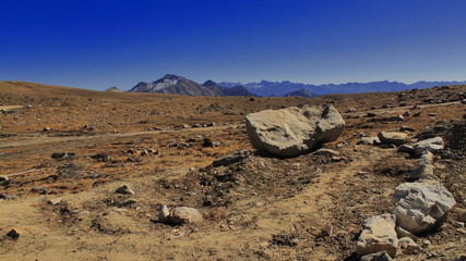 arid landscape of tibetan plateau and snow-capped himalaya at bum la pass near tawang in arunachal pradesh, india