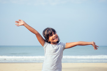 cute girl 7 or 8 years old Asian American mixed enjoying holidays.travel medical insurance concept