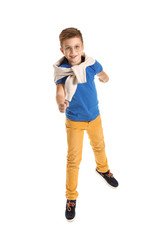 Jumping fashionable boy on white background