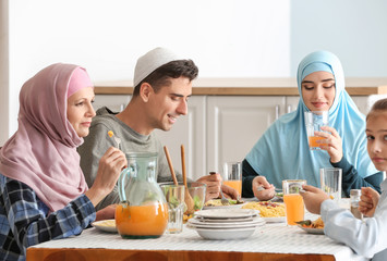Muslim family having dinner at home