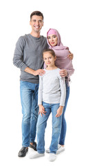 Portrait of Muslim family on white background