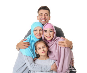 Portrait of Muslim family on white background