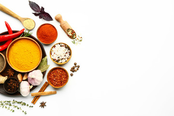 Many different spices on white background