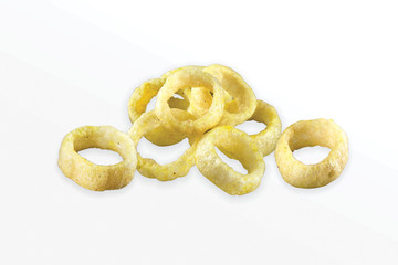 Fried Spicy, Salty and tasty fried corn rings Snacks or Fryums (Snacks Pellets) Salty Mini Ring Snack, white background, selective focus - Image