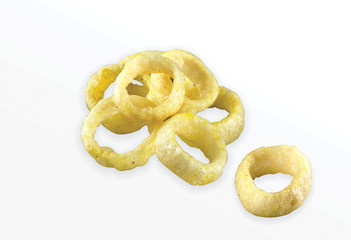 Fried Spicy, Salty and tasty fried corn rings Snacks or Fryums (Snacks Pellets) Salty Mini Ring Snack, white background, selective focus - Image