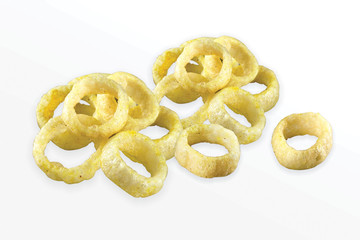 Fried Spicy, Salty and tasty fried corn rings Snacks or Fryums (Snacks Pellets) Salty Mini Ring Snack, white background, selective focus - Image