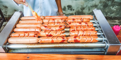 Semarang, Central Java, Indonesia - December 30, 2019: Grilled sausages on grill iron. Cimory On The Valley.