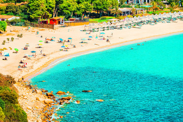 Shore of Beautiful Villasimius Beach at the Bay of the Blue Waters of the Mediterranean Sea in Sardinia Island in Italy in summer. Cagliari region.