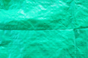 Texture graphic resource green plastic sack coat close up details, green plastic sack