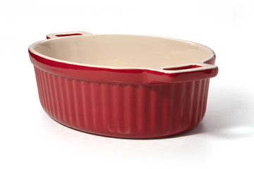 Red ceramic baking dish on a white background